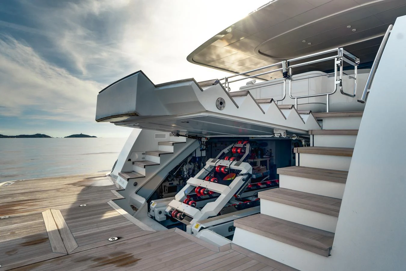 The image showcases a yacht's innovative storage area for water toys, featuring a sleek and modern design. aboard L.A.U.L. Yacht for Sale
