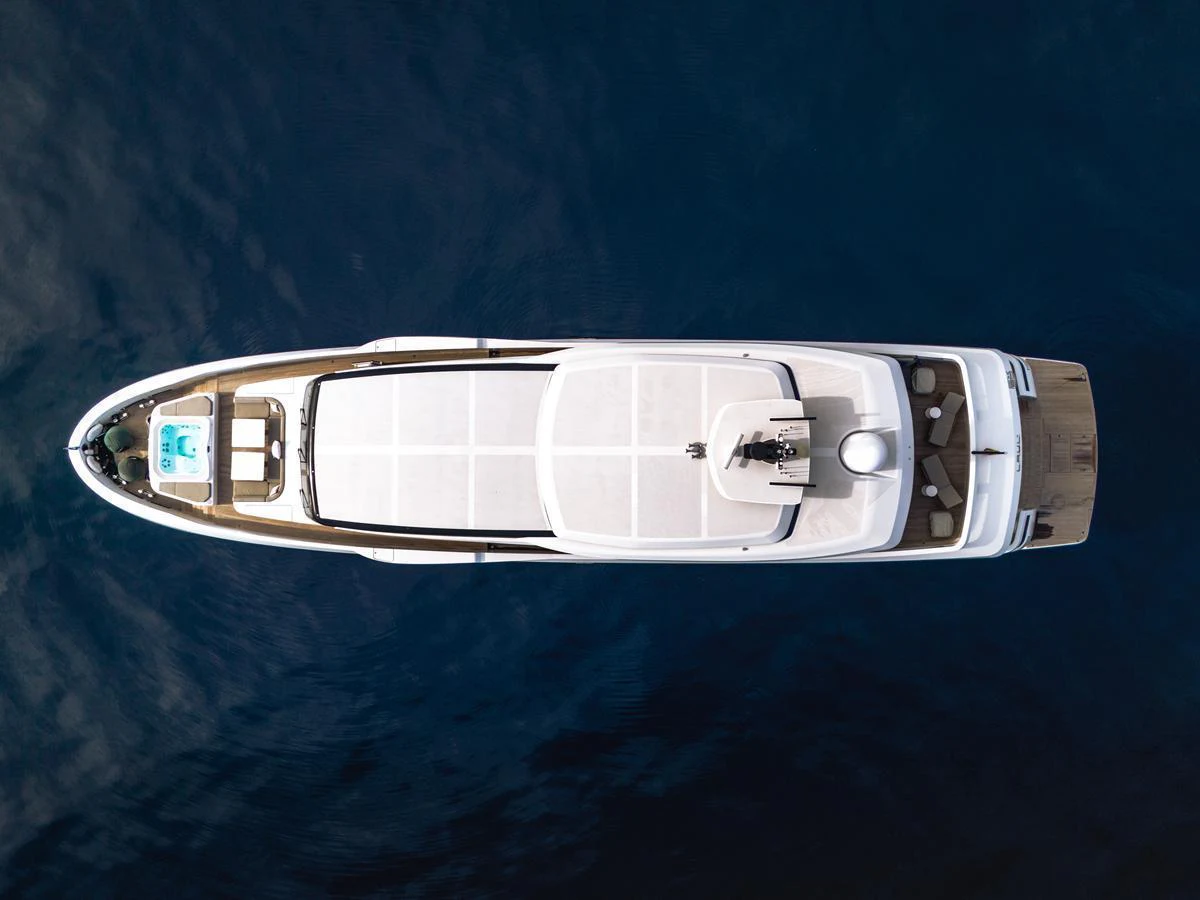An elegant yacht is captured from above, showcasing its sleek design and spacious deck areas. aboard L.A.U.L. Yacht for Sale