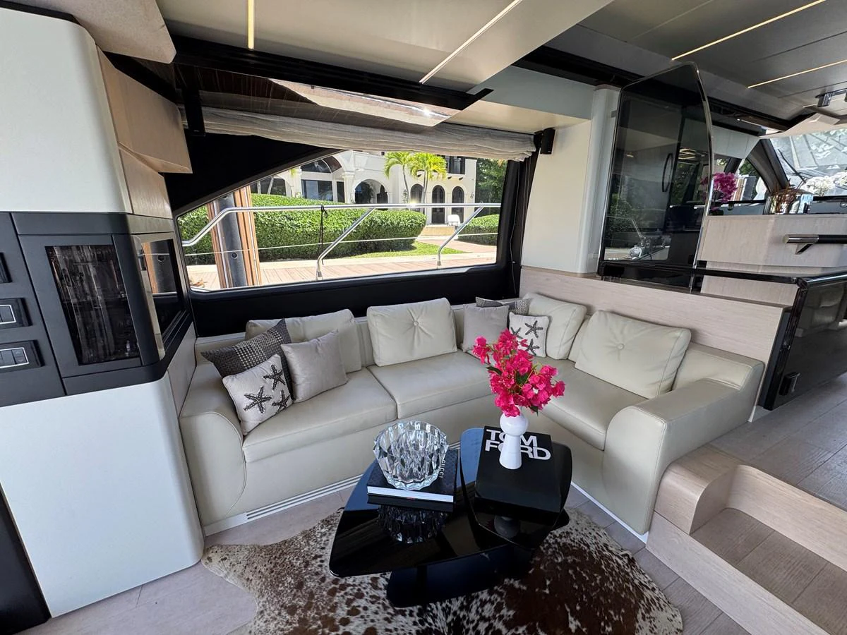 a living room with a couch and a table aboard XAX66046F718 Yacht for Sale