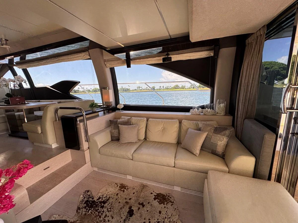 a living room with a large window aboard XAX66046F718 Yacht for Sale