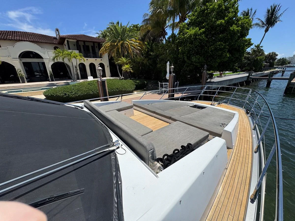a pool with a house and trees in the background aboard XAX66046F718 Yacht for Sale