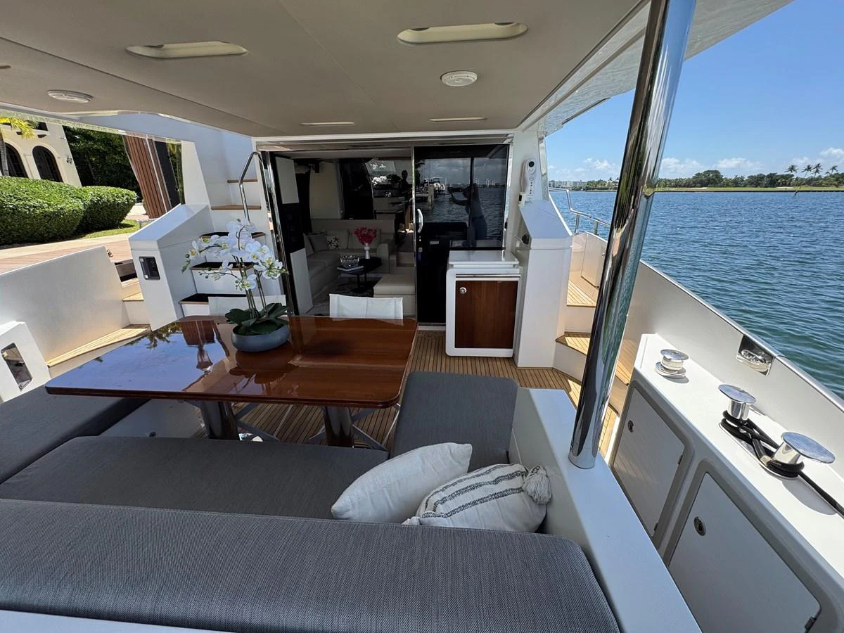 a living room with a large window aboard XAX66046F718 Yacht for Sale