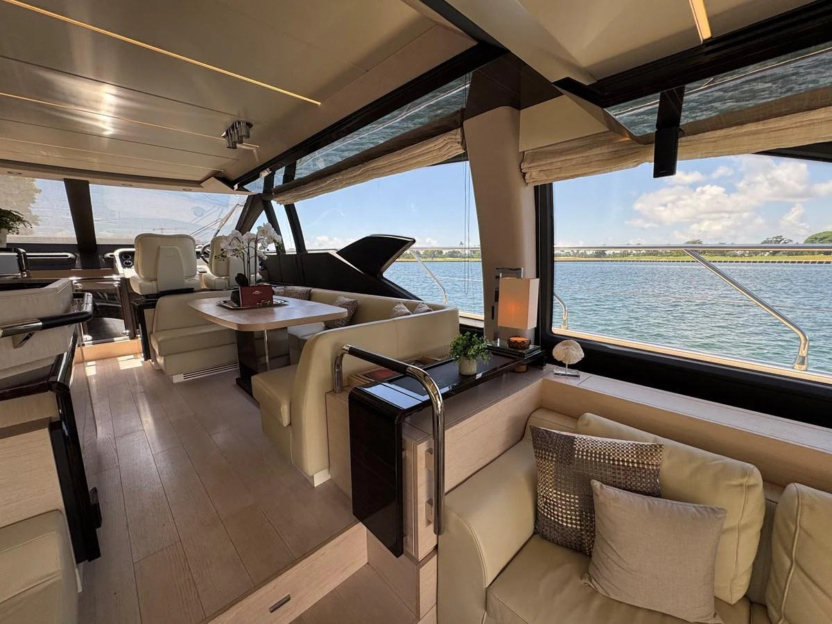 a room with a table chairs and a view of the ocean aboard XAX66046F718 Yacht for Sale