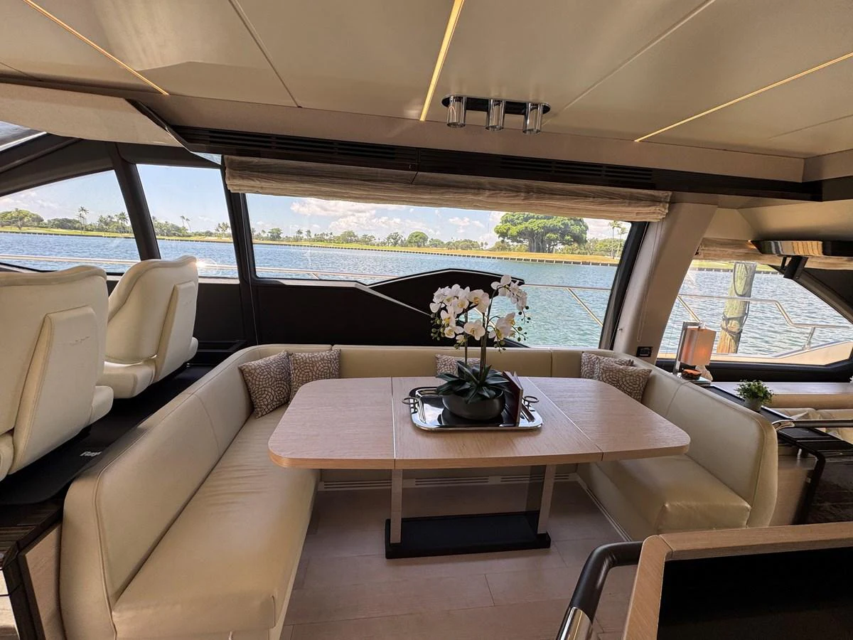 a room with a table and chairs aboard XAX66046F718 Yacht for Sale