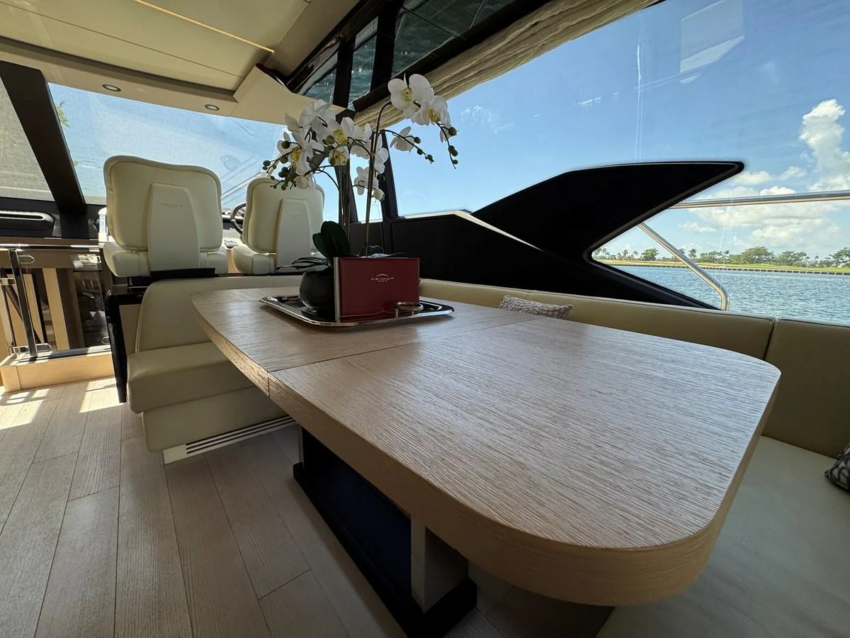 a table with a laptop on it aboard XAX66046F718 Yacht for Sale