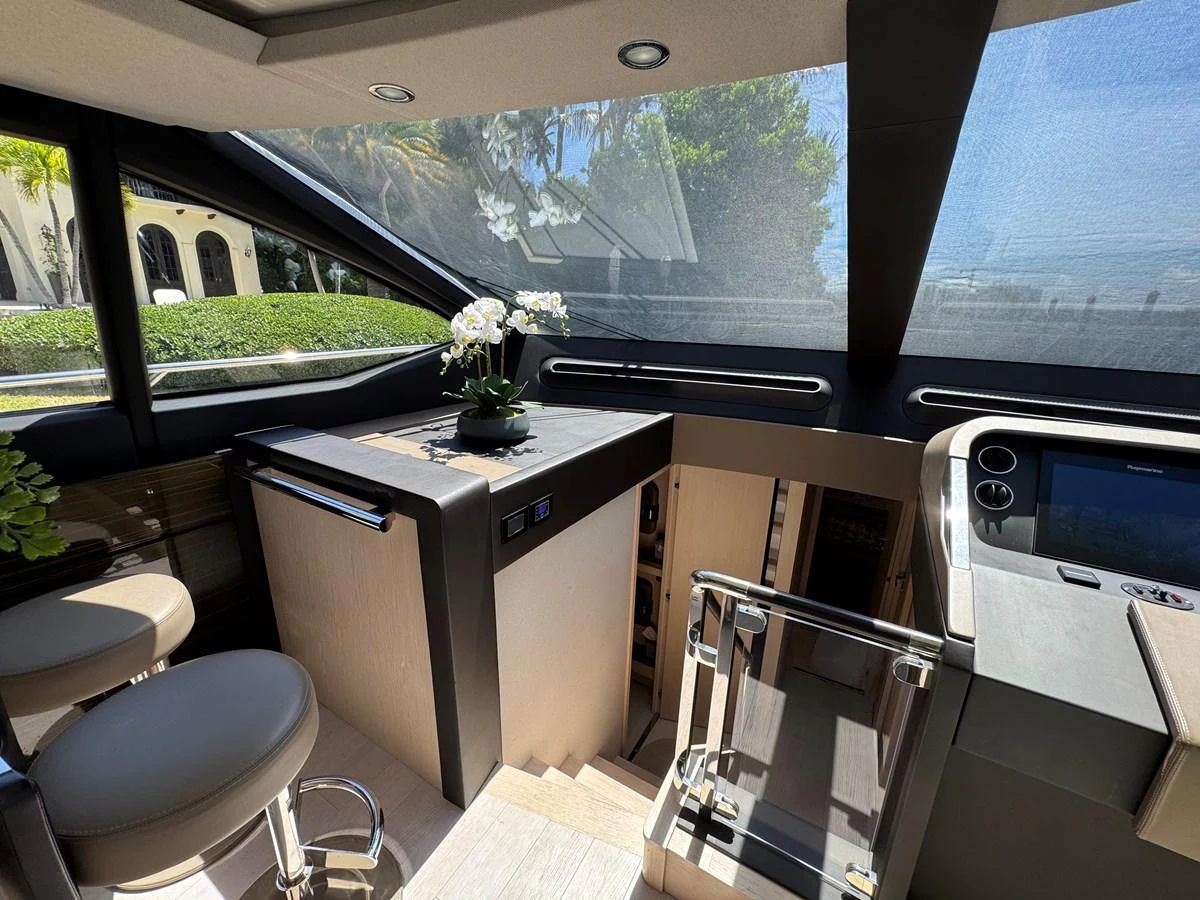 a room with a table and chairs aboard XAX66046F718 Yacht for Sale