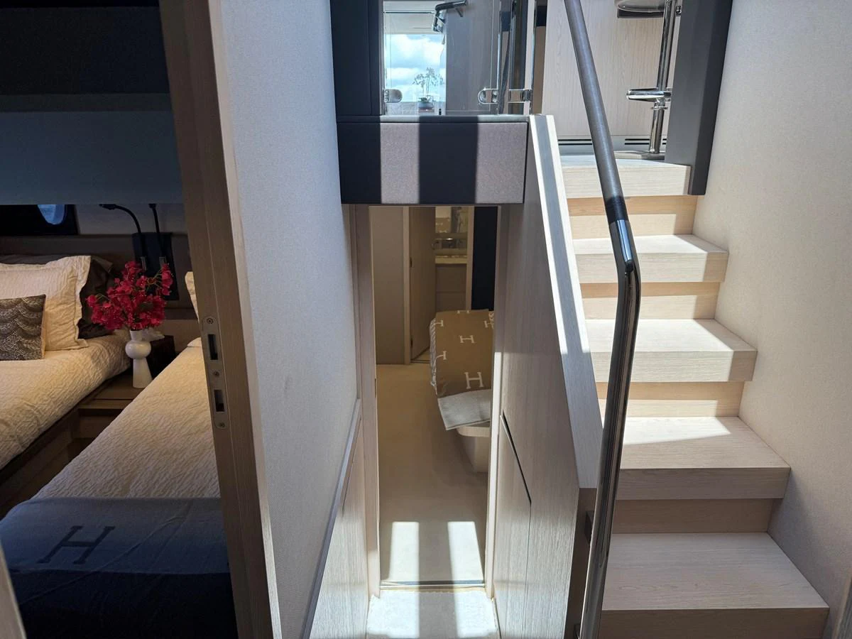 a staircase with a white railing aboard XAX66046F718 Yacht for Sale
