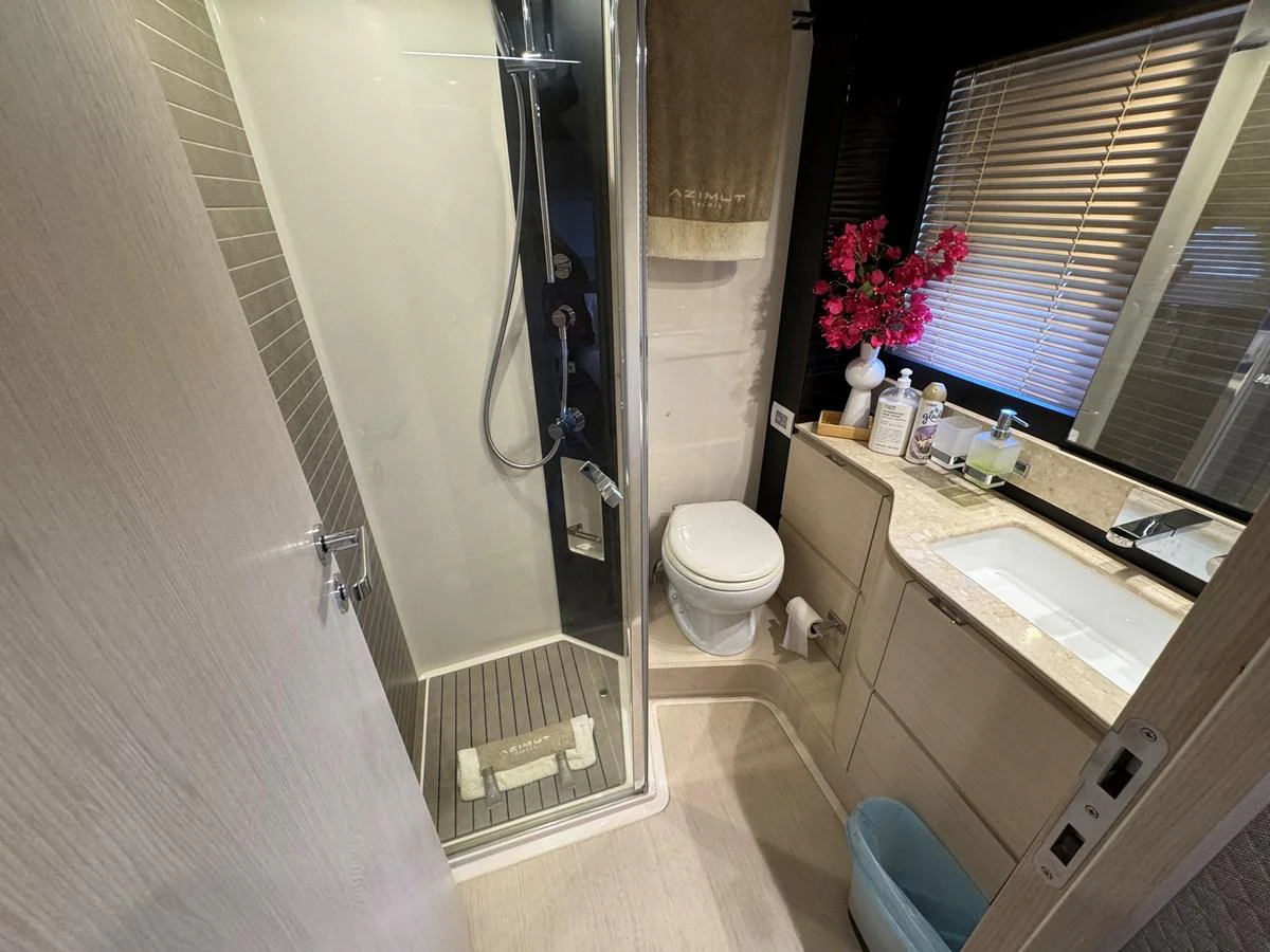 a bathroom with a sink toilet and a window aboard XAX66046F718 Yacht for Sale