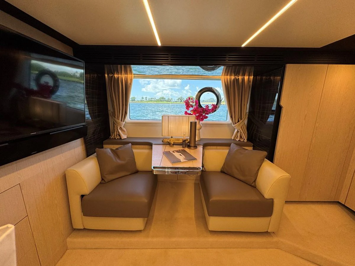 a living room with a large window aboard XAX66046F718 Yacht for Sale