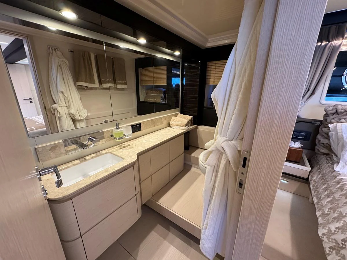 a bathroom with a large mirror aboard XAX66046F718 Yacht for Sale