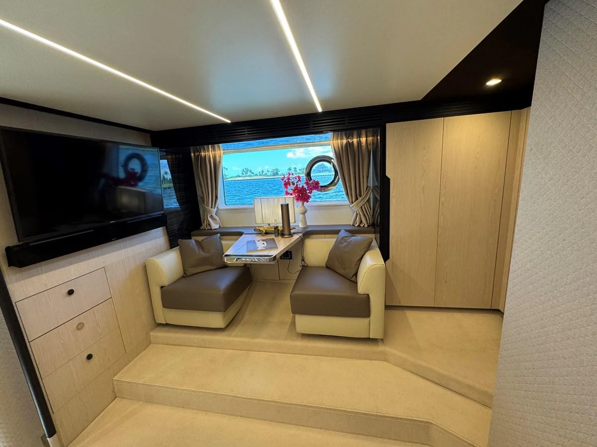 a room with a tv and a couch aboard XAX66046F718 Yacht for Sale
