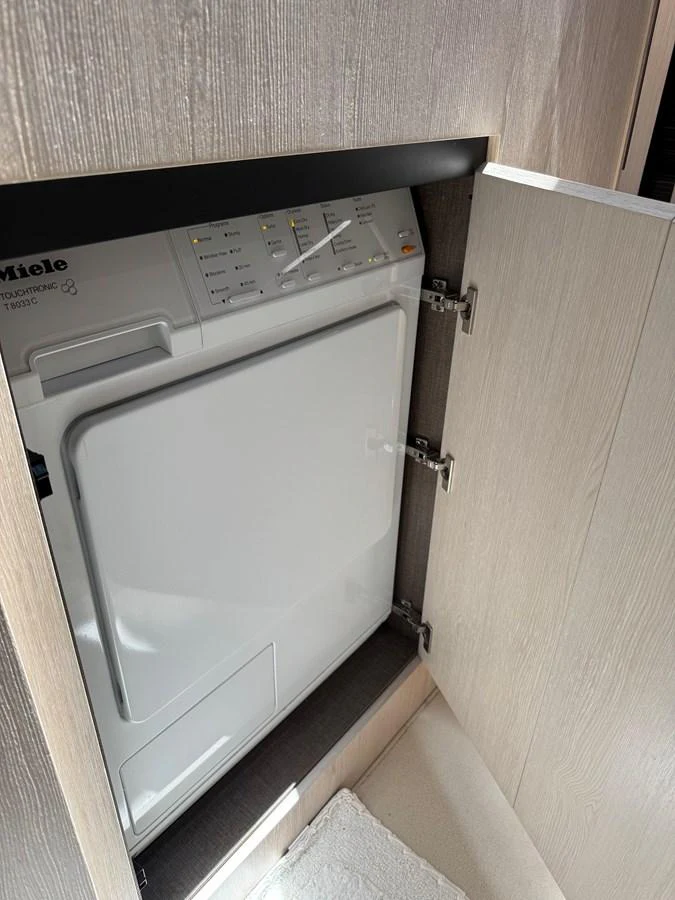 a white machine in a room aboard XAX66046F718 Yacht for Sale