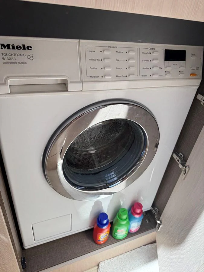a washer and dryer in a kitchen aboard XAX66046F718 Yacht for Sale