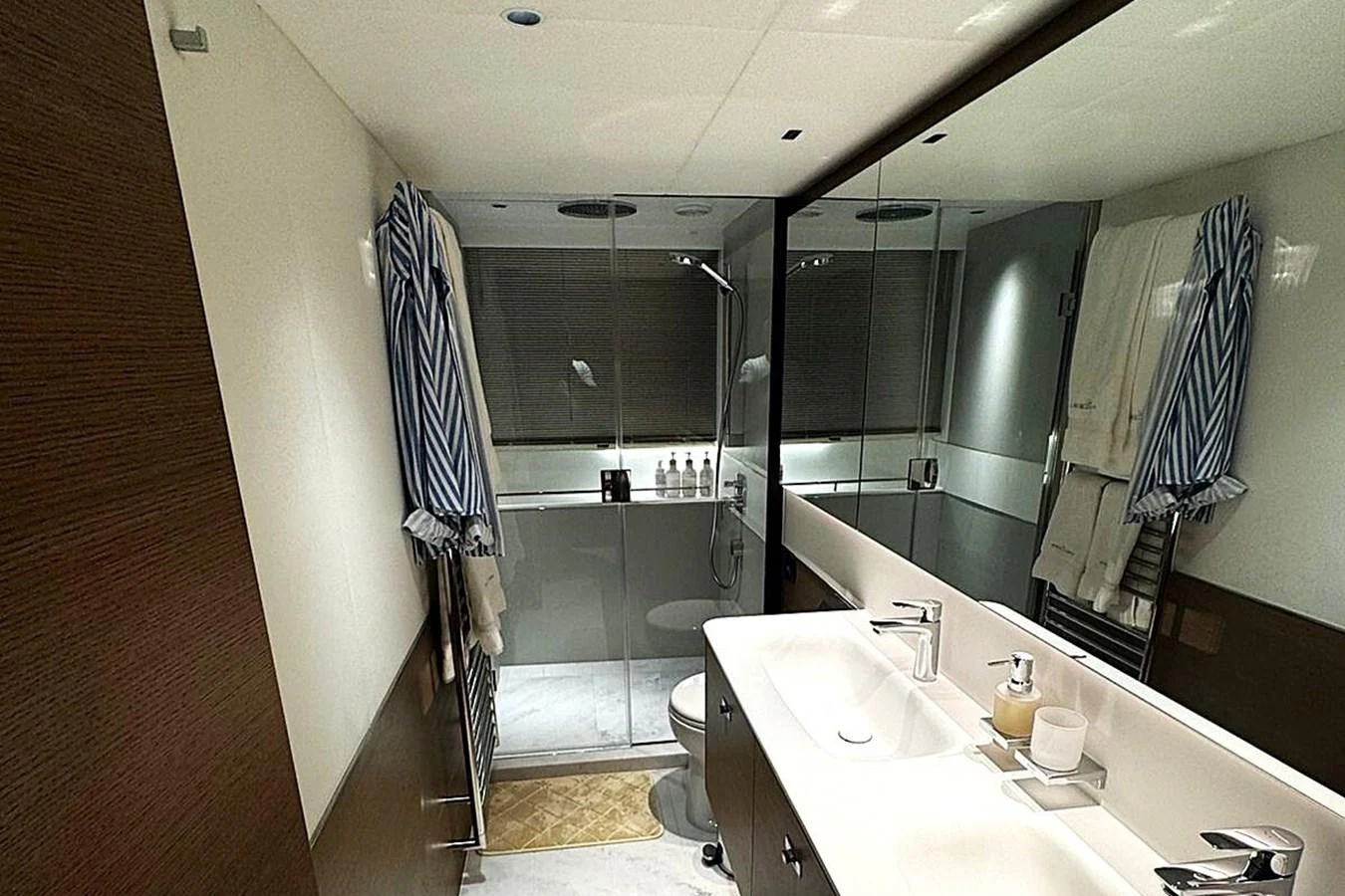 a bathroom with a sink and a shower aboard SOLOMON Yacht for Sale
