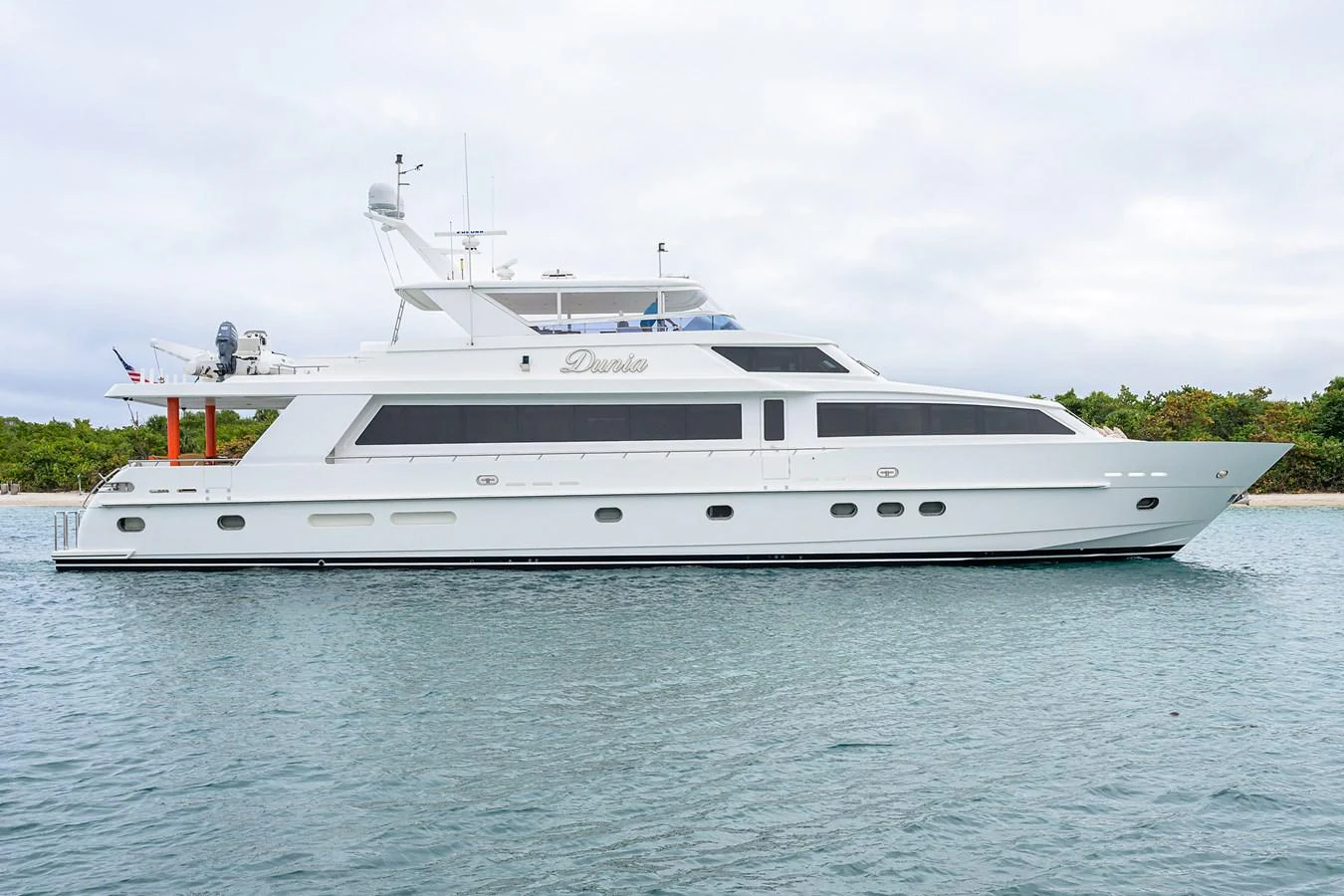 a white yacht in the water aboard DUNIA Yacht for Sale