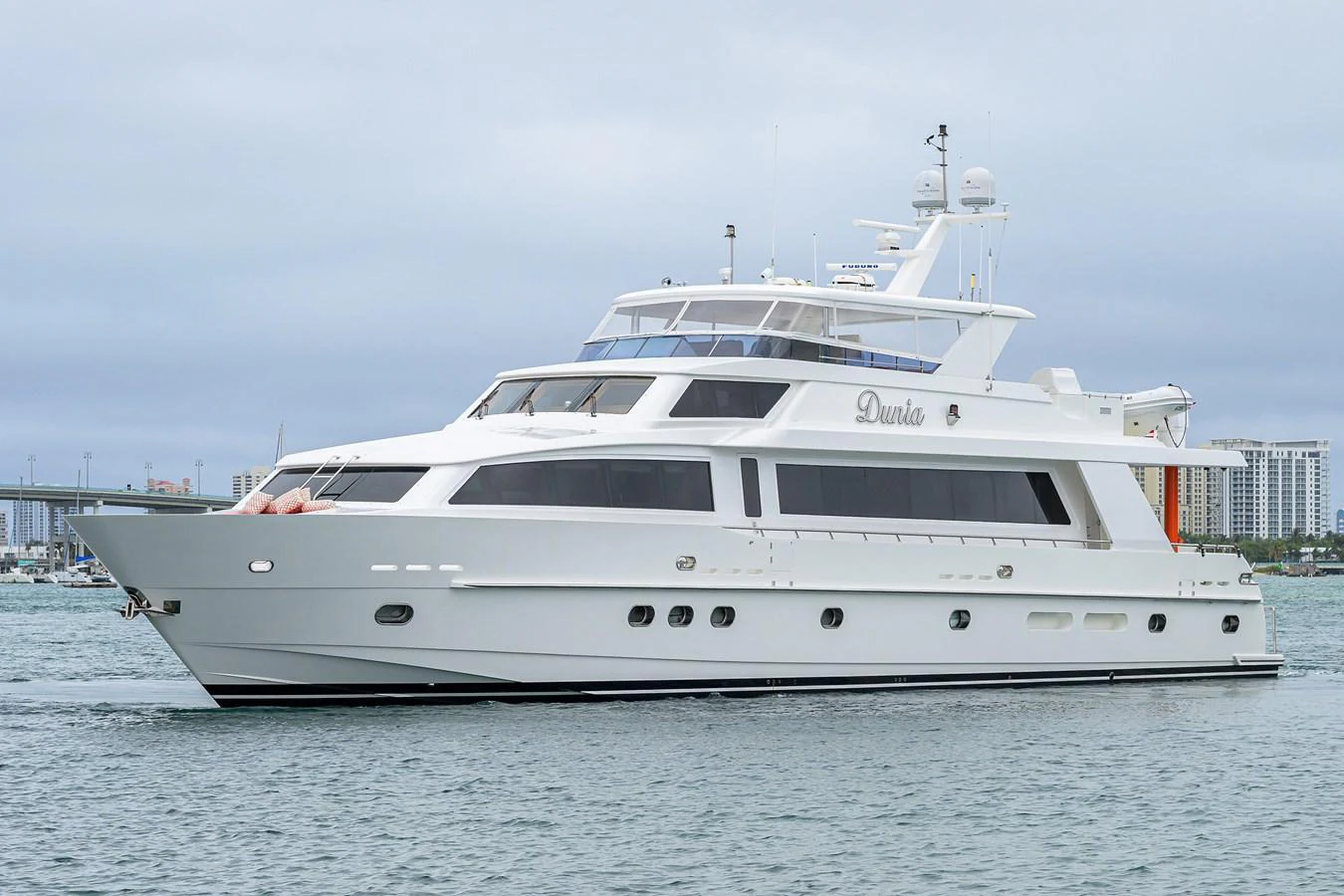 a white yacht on the water aboard DUNIA Yacht for Sale