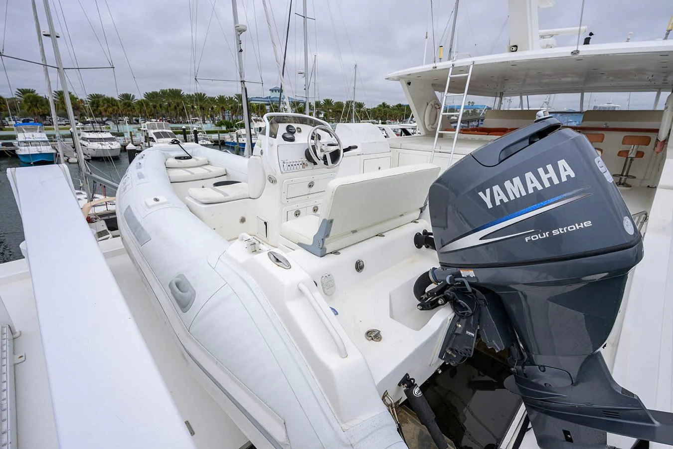 a boat with a motor attached to it aboard DUNIA Yacht for Sale