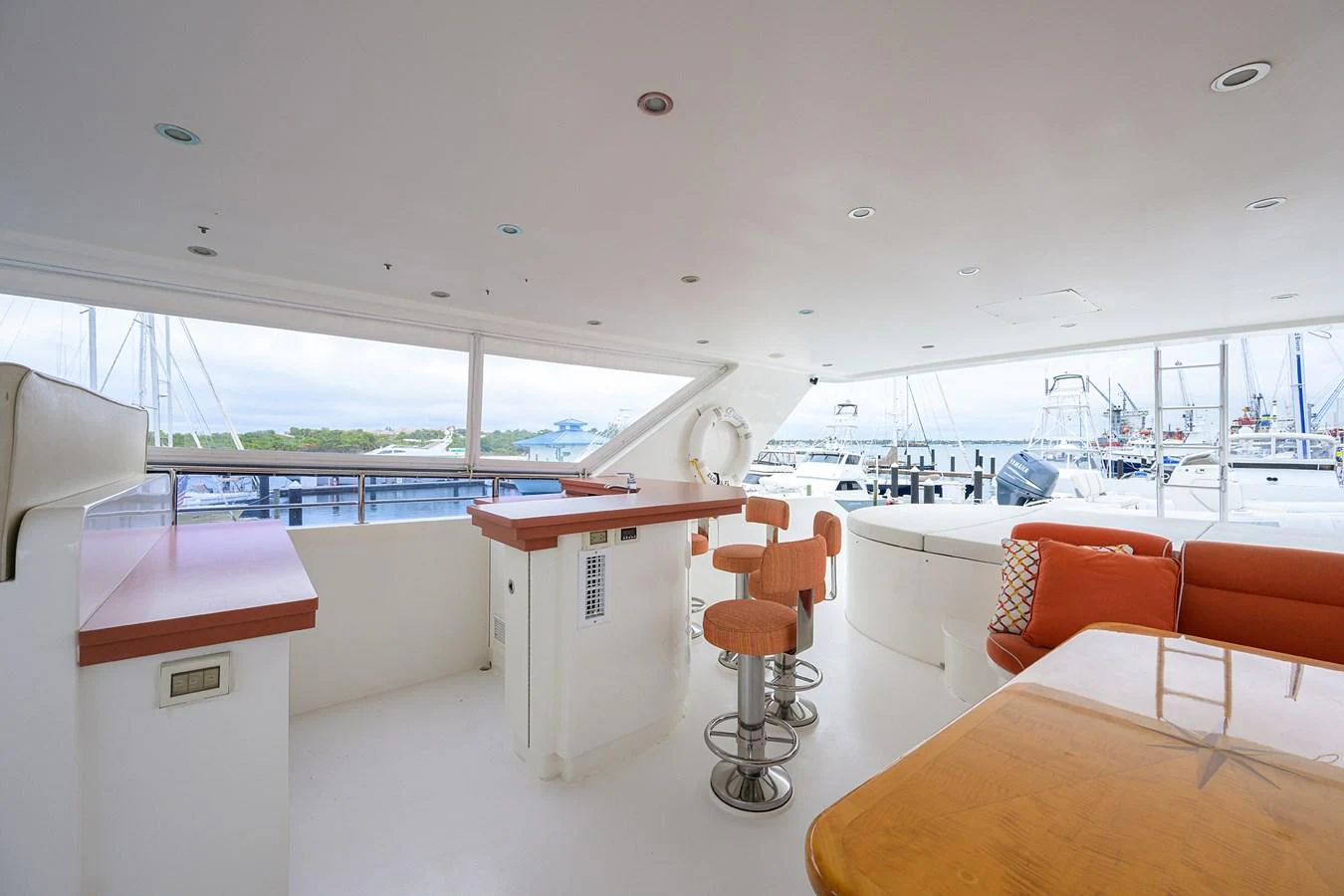 a room with a table and chairs aboard DUNIA Yacht for Sale
