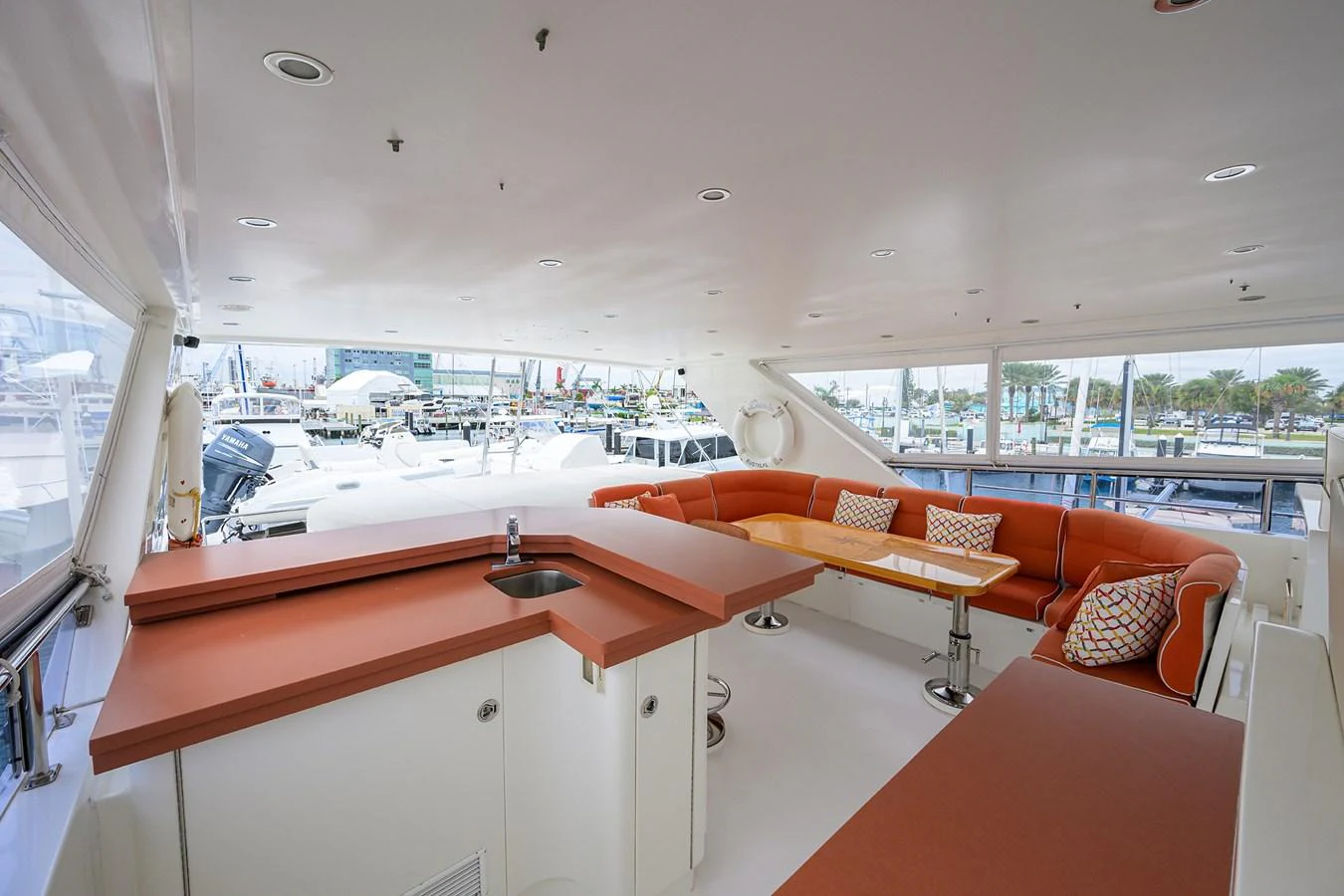 a room with a view of the water and a city aboard DUNIA Yacht for Sale