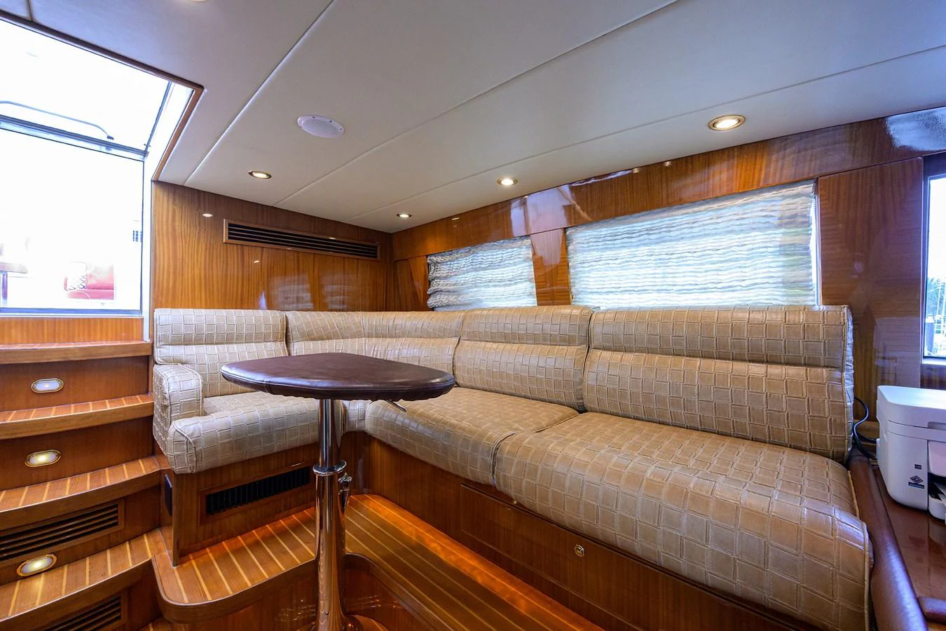 a living room with a couch and a coffee table aboard DUNIA Yacht for Sale