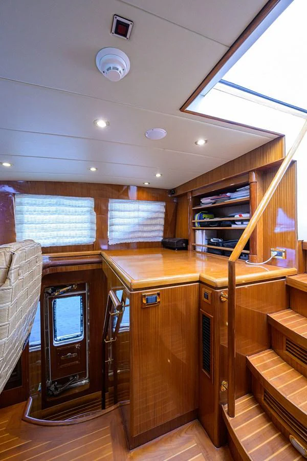 a room with a tv and a cabinet aboard DUNIA Yacht for Sale