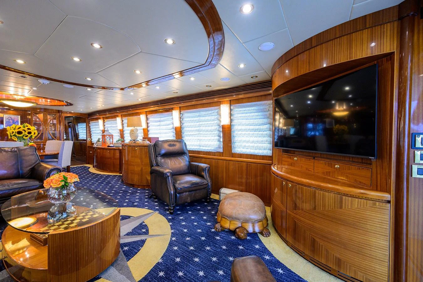a living room with a large mirror aboard DUNIA Yacht for Sale