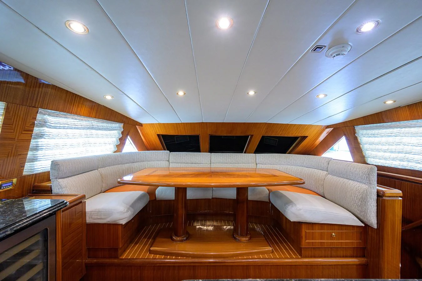 a room with a couch and a table aboard DUNIA Yacht for Sale