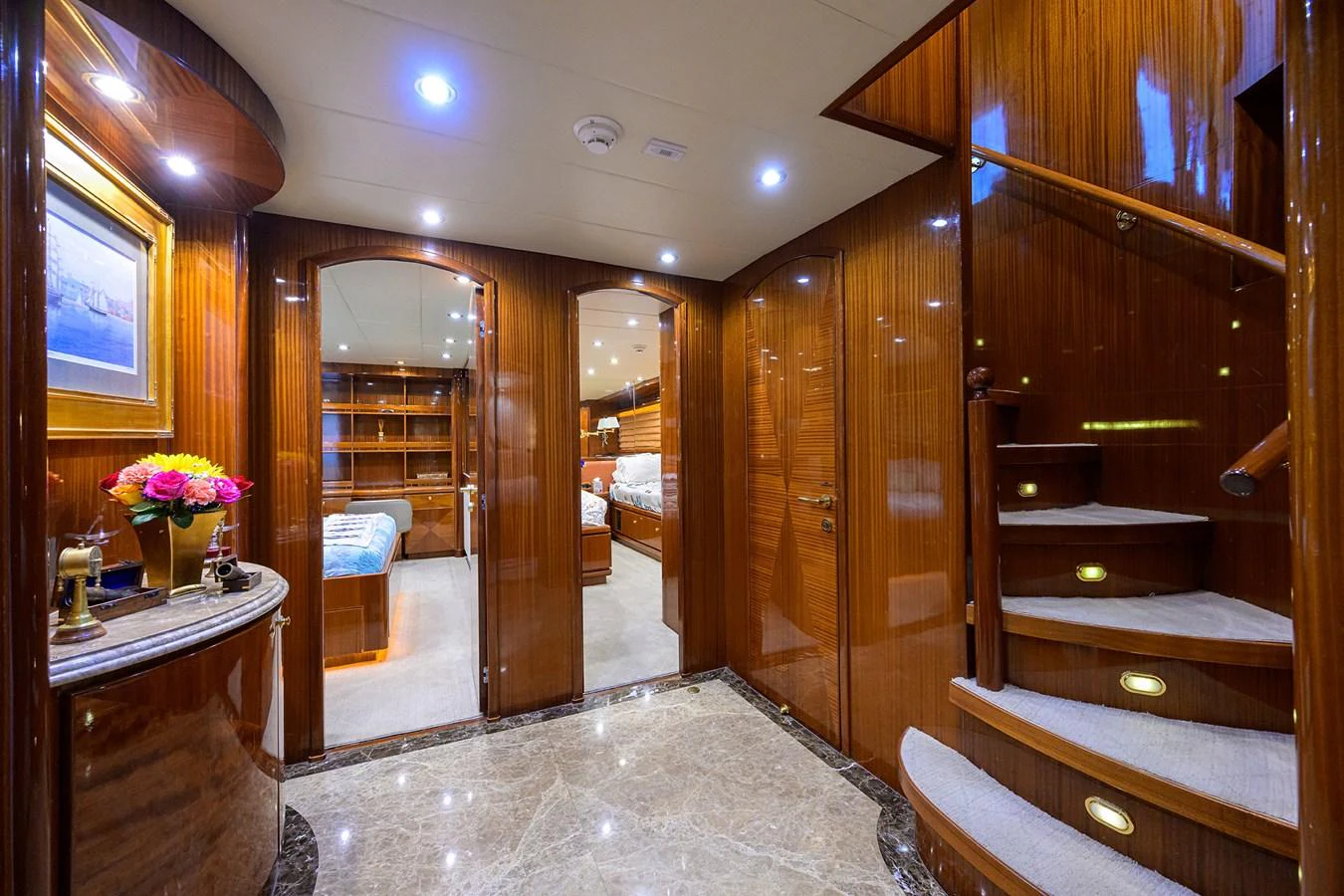 a room with a wood wall and a wood door aboard DUNIA Yacht for Sale