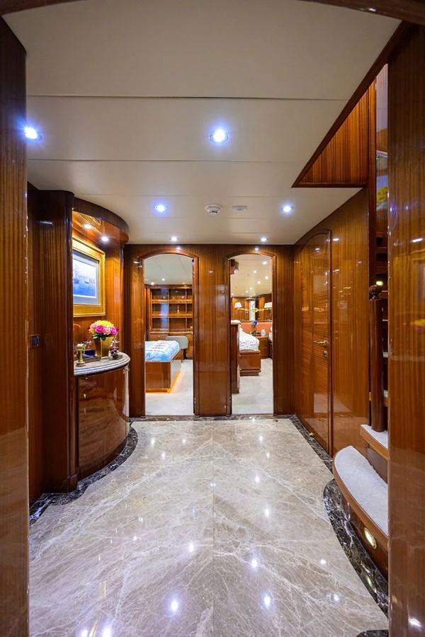 a room with a table and chairs aboard DUNIA Yacht for Sale