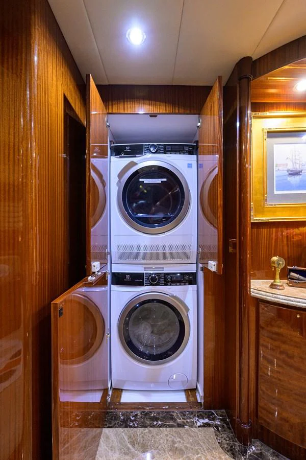 a washer and dryer in a room aboard DUNIA Yacht for Sale