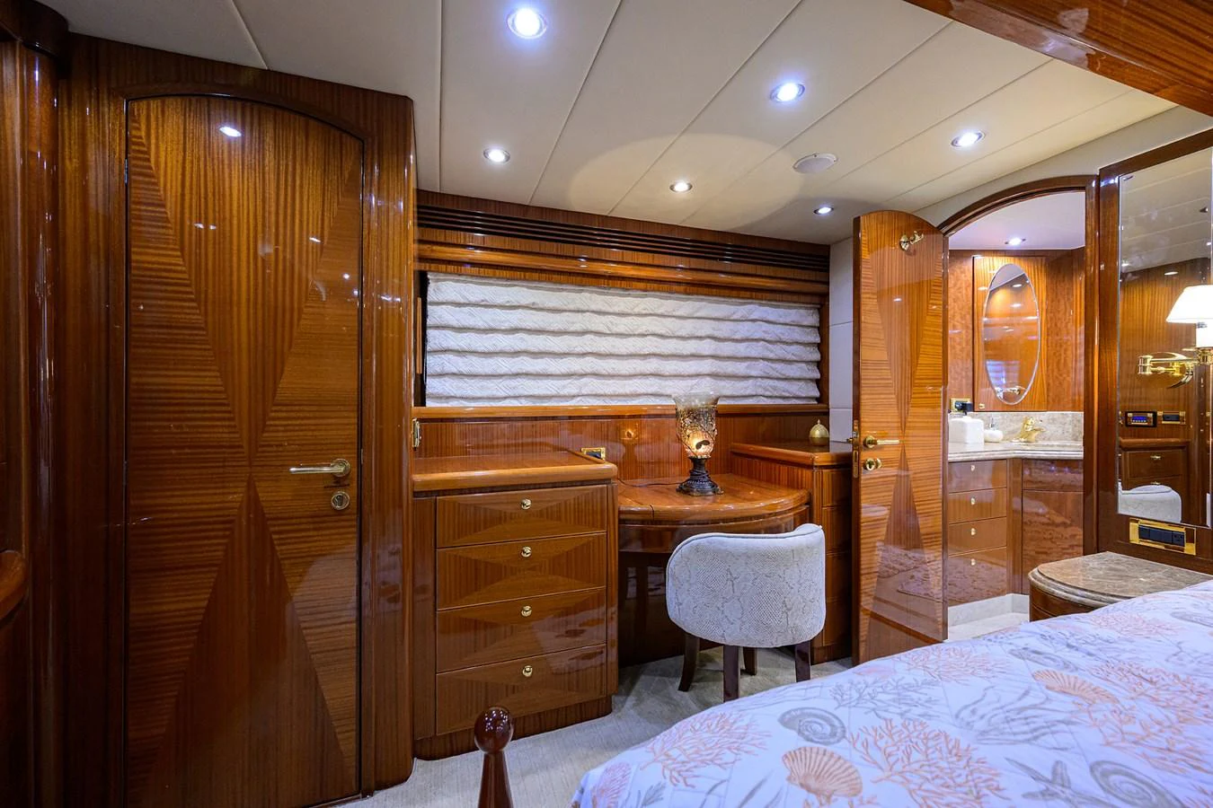 a room with a bed and a table aboard DUNIA Yacht for Sale