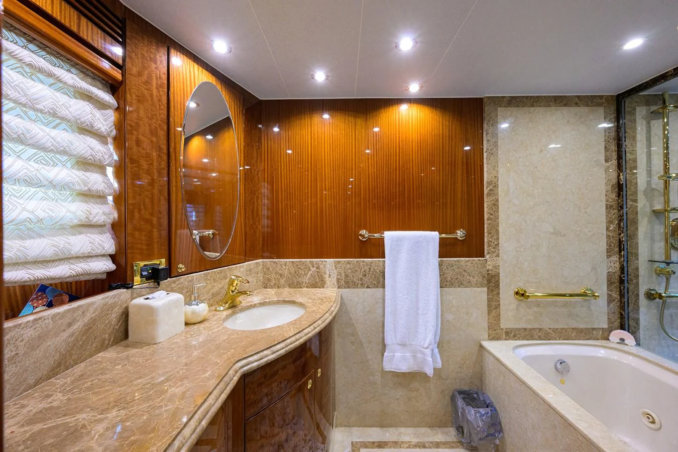 a bathroom with a large mirror aboard DUNIA Yacht for Sale