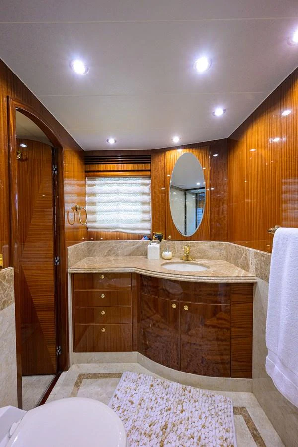 a bathroom with a large mirror aboard DUNIA Yacht for Sale