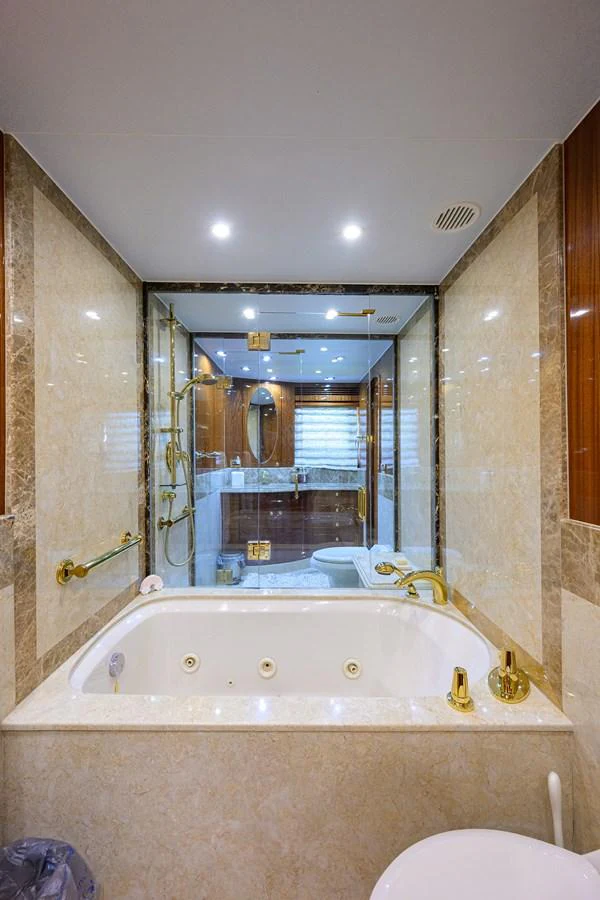 a bathroom with a large mirror aboard DUNIA Yacht for Sale