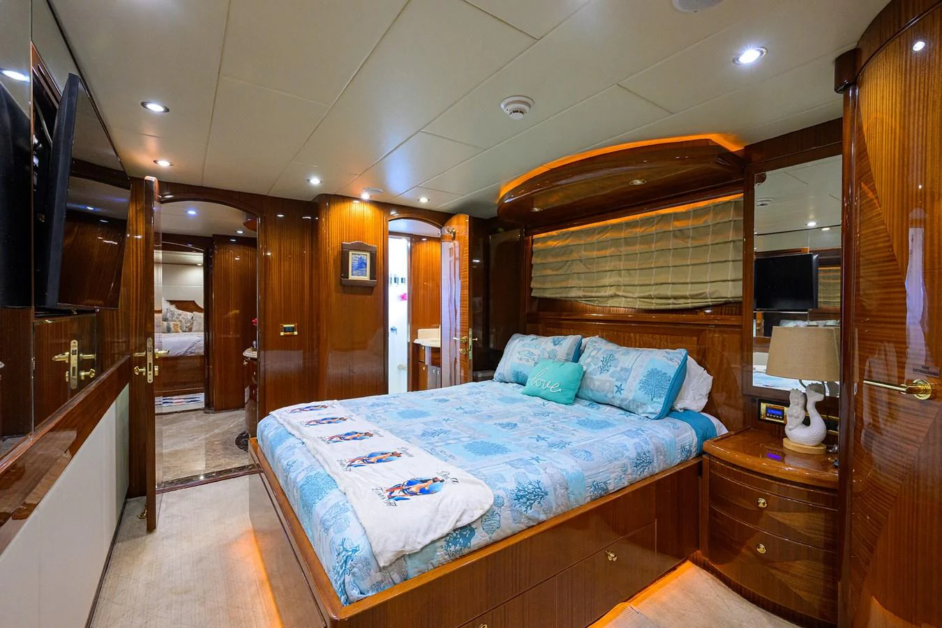 a bedroom with a bed aboard DUNIA Yacht for Sale