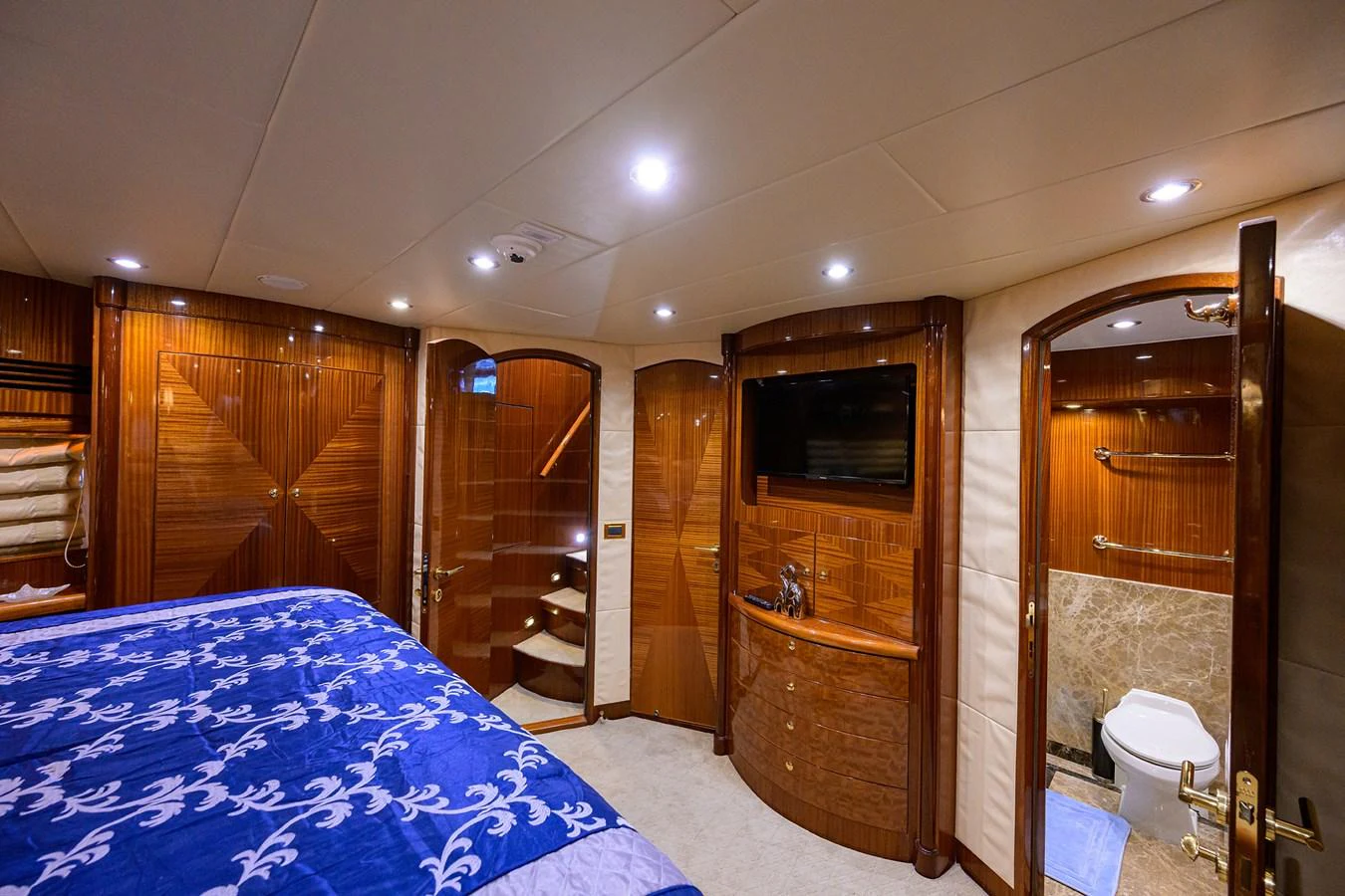 a bathroom with a large blue and white rug aboard DUNIA Yacht for Sale