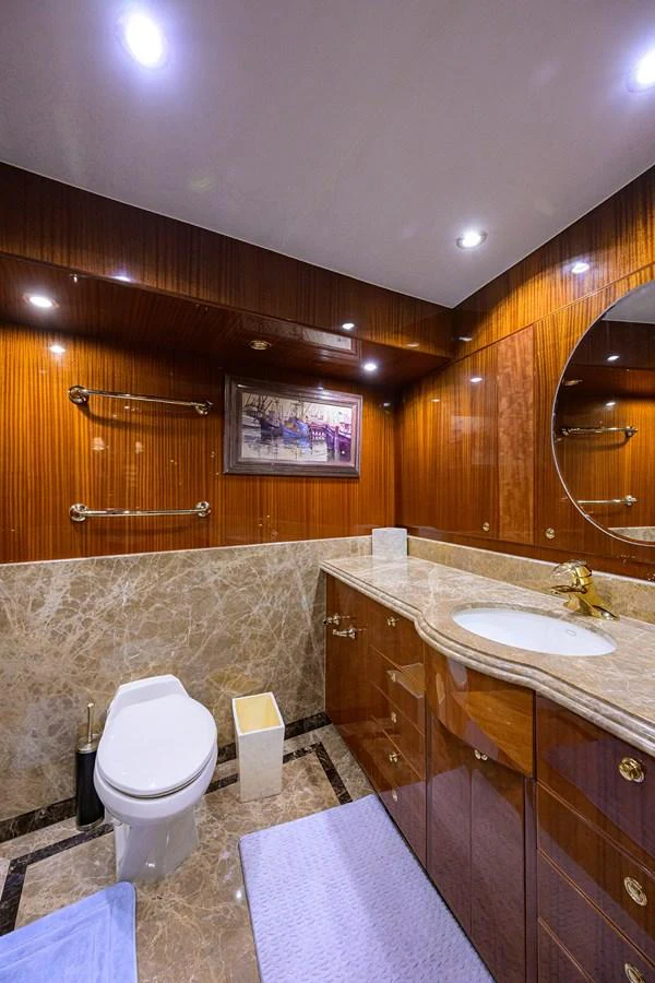 a bathroom with a toilet and sink aboard DUNIA Yacht for Sale