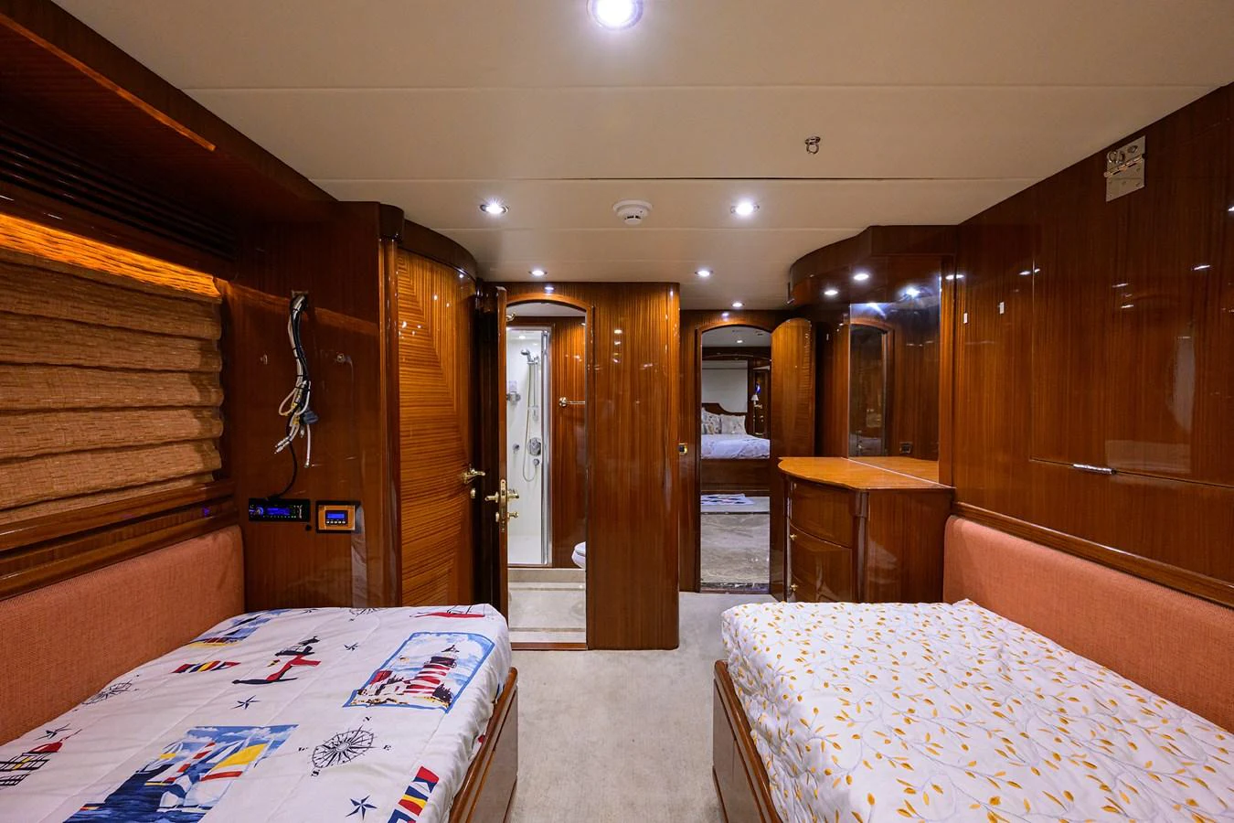 a room with a bed and a door aboard DUNIA Yacht for Sale