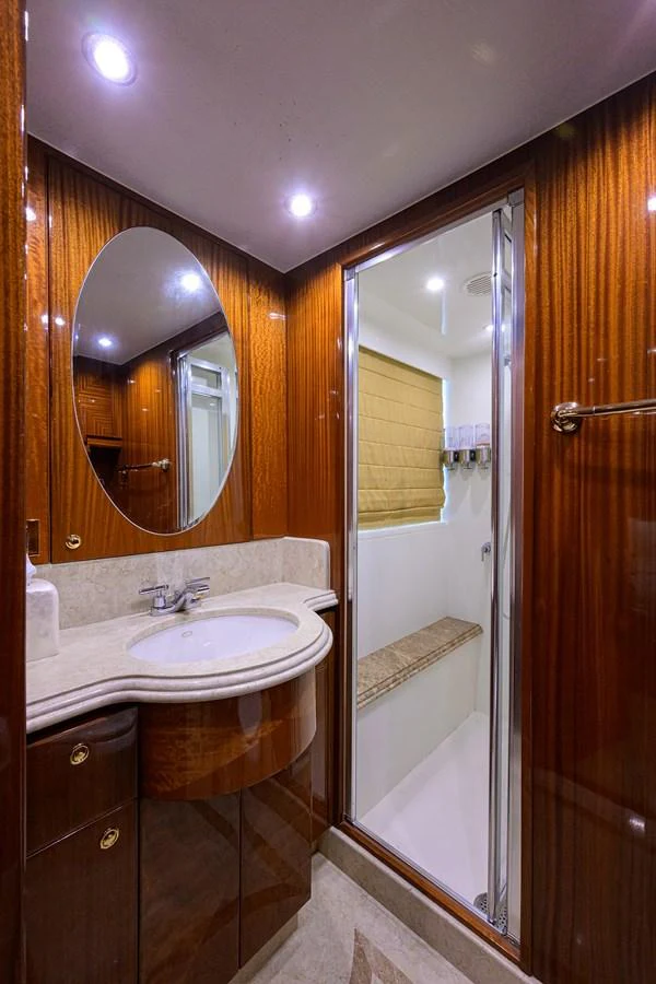 a bathroom with a sink and a mirror aboard DUNIA Yacht for Sale