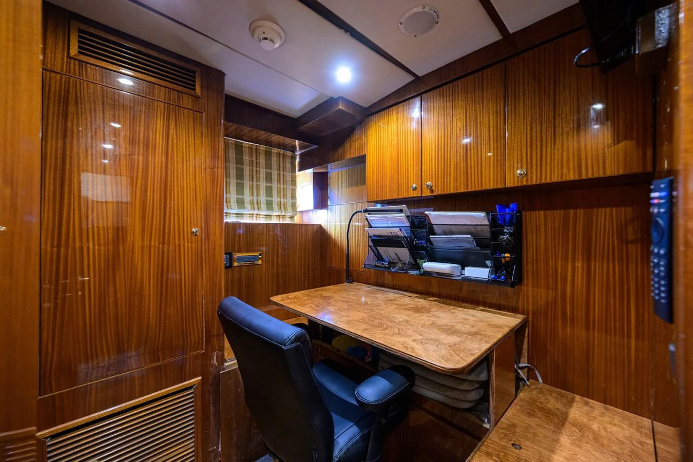 a room with a table and chairs aboard DUNIA Yacht for Sale