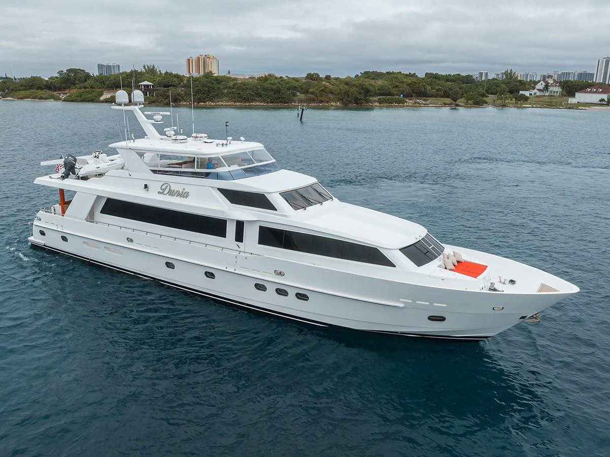 a white yacht in the water aboard DUNIA Yacht for Sale