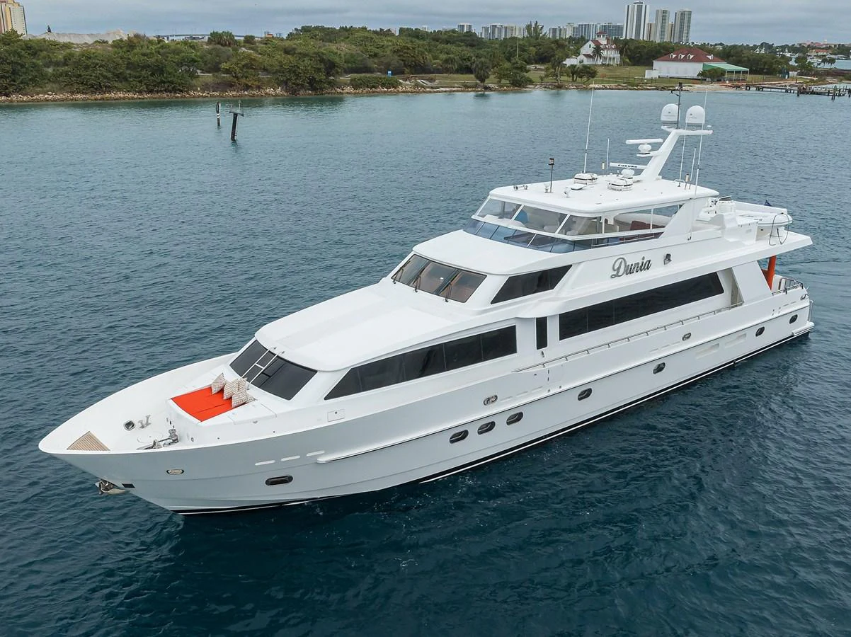 a white yacht in the water aboard DUNIA Yacht for Sale