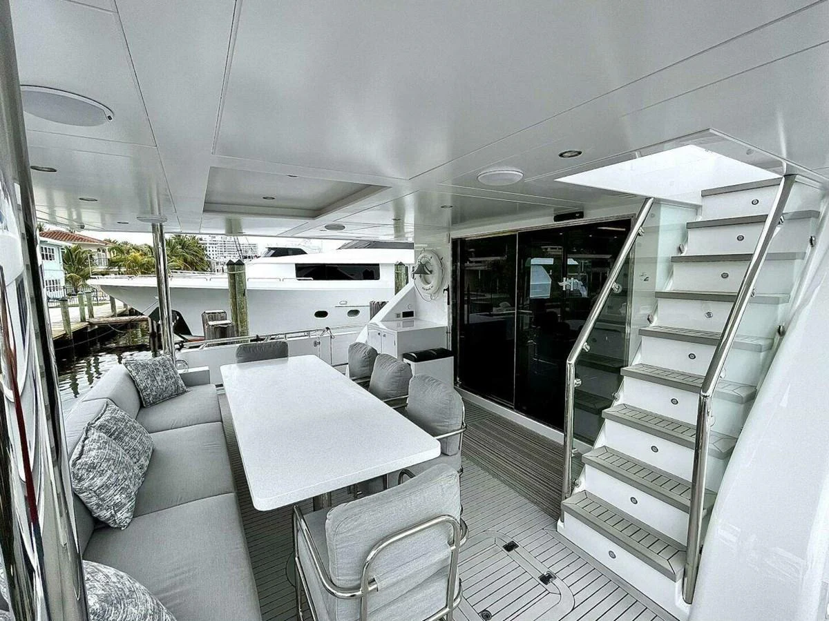 a room with a table and chairs aboard SCORPIO II Yacht for Sale