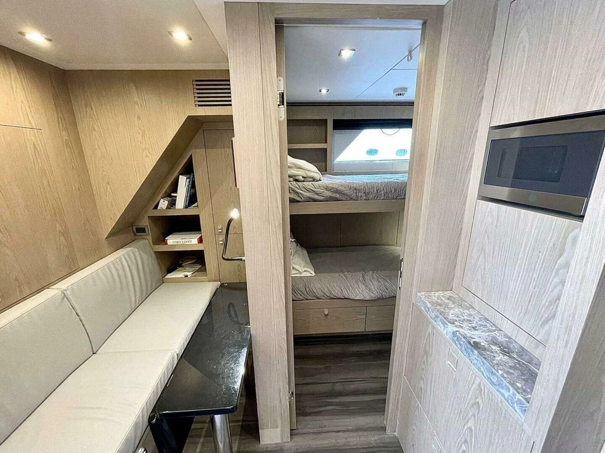 a room with bunk beds aboard SCORPIO II Yacht for Sale