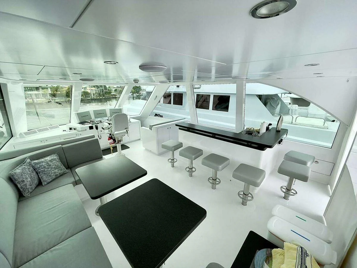 a room with a couch and a table aboard SCORPIO II Yacht for Sale