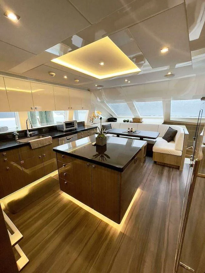 a kitchen with a large island aboard SCORPIO II Yacht for Sale