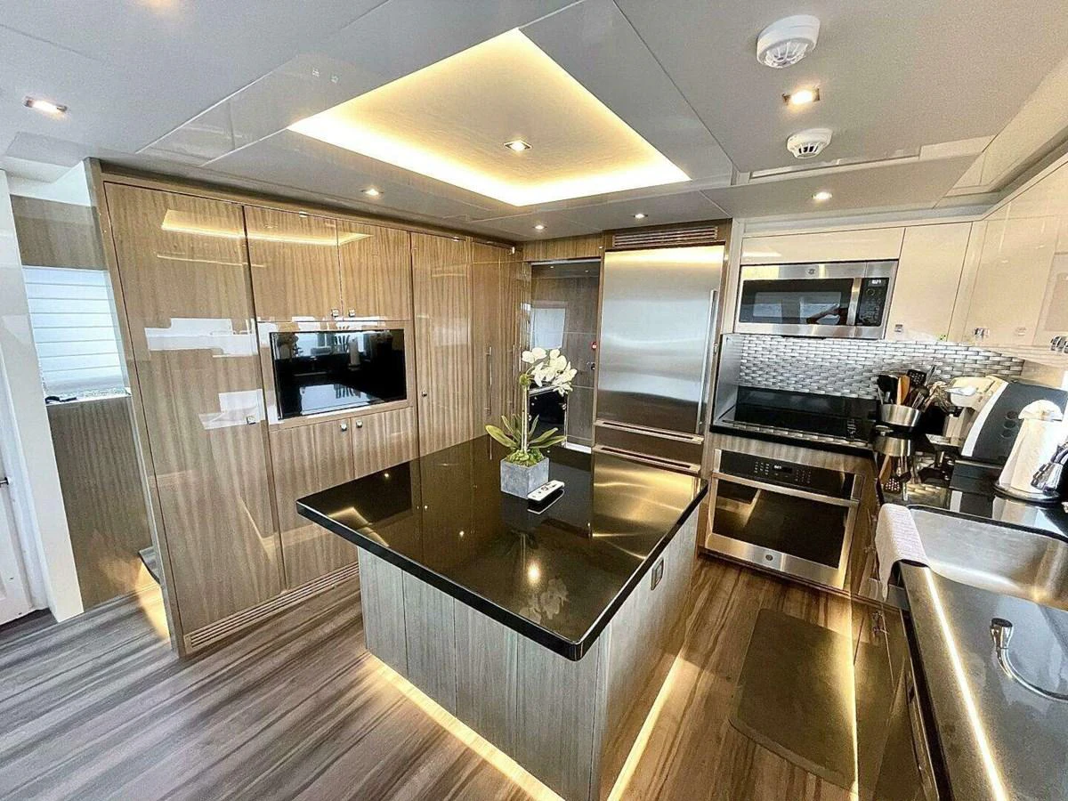 a kitchen with a large island aboard SCORPIO II Yacht for Sale