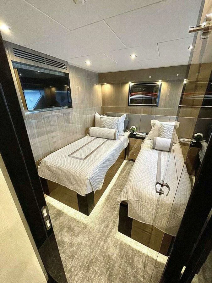 a room with a bed and a mirror aboard SCORPIO II Yacht for Sale