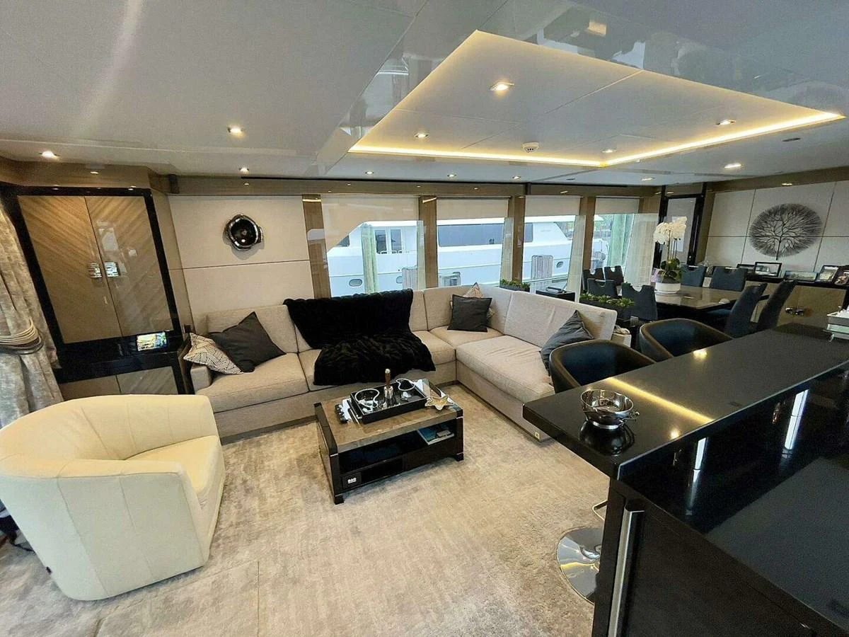 a living room with a large glass window aboard SCORPIO II Yacht for Sale