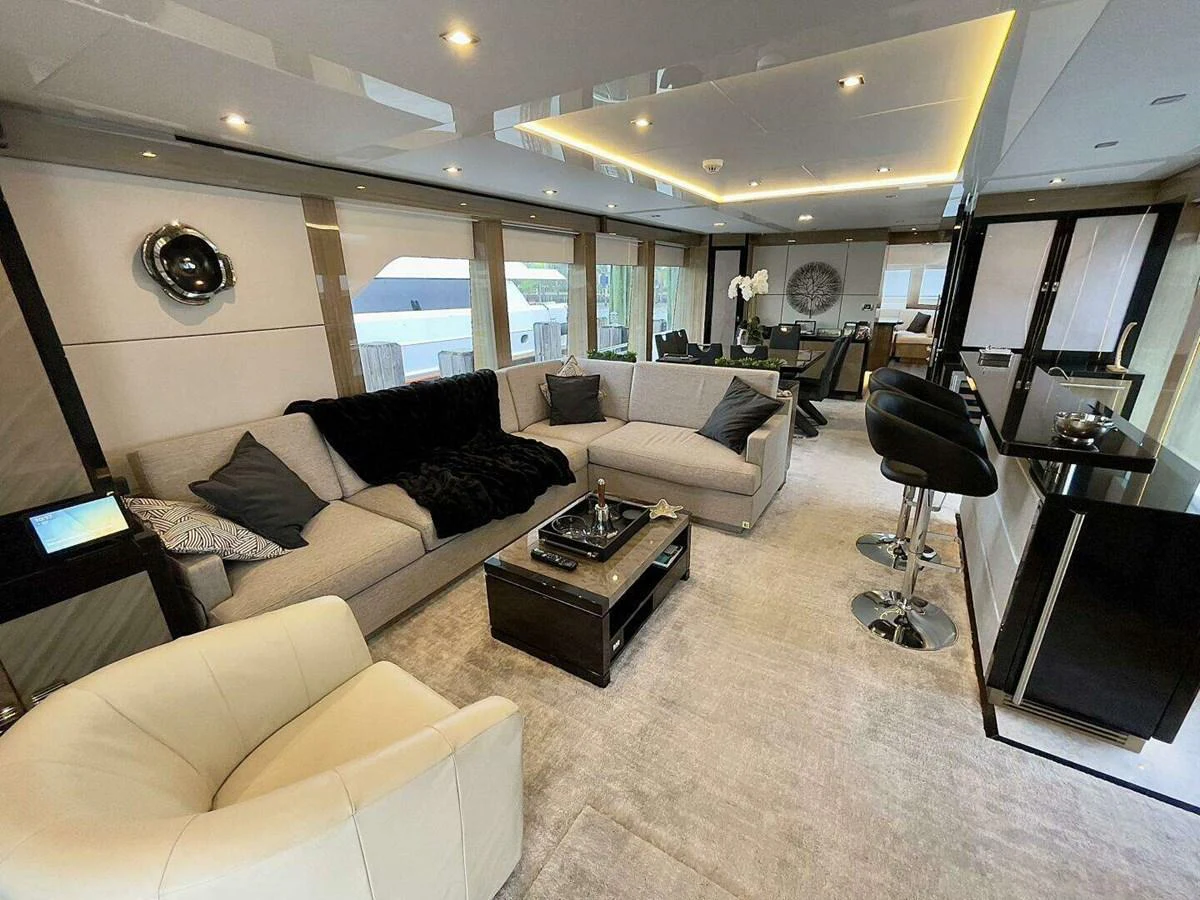 a living room with a large window aboard SCORPIO II Yacht for Sale